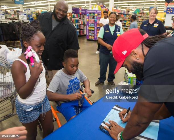 American football player Michael Griffin signs autographs and meets with customers at Walmart on September 23, 2017 in Hopkinsville, Kentucky.