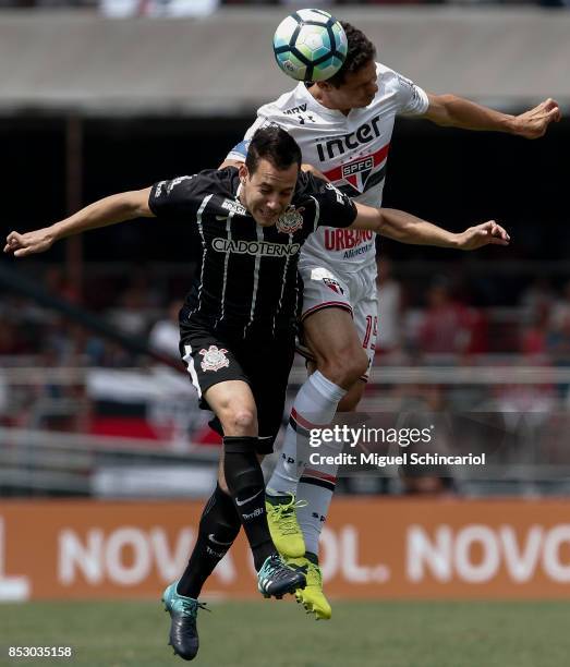 Hernanes of Sao Paulo vies the ball with Rodriguinho of Corinthians during the match between Sao Paulo and Corinthians for the Brasileirao Series A...
