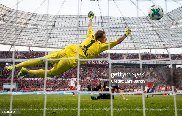 Lucas Nicolas Alario of Bayer Leverkusen scores his teams second goal against Christian Mathenia of Hamburg during the Bundesliga match between Bayer...