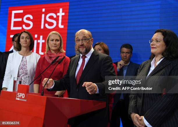 Chairman and candidate for Chancellor Martin Schulz reacts on stage with German Family Minister Katarina Barley , State Premier of...