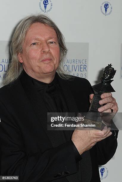 Christopher Hampton poses with the Best New Comedy Award for God of Carnage presented by Patrick Stewart during The Laurence Olivier Awards at The...