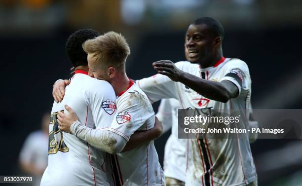 Milton Keynes Ben Reeves is congratulated on scoring their winning goal by teammate Ryan Hall during the Sky Bet League One match at Stadium:mk,...