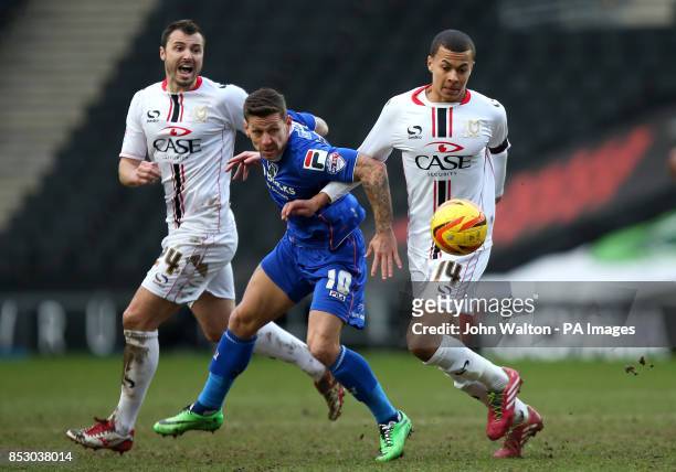 Milton Keynes Dele Alli and Oldham Athletic's Charlie Macdonald battles for possession of the ball during the Sky Bet League One match at Stadium:mk,...
