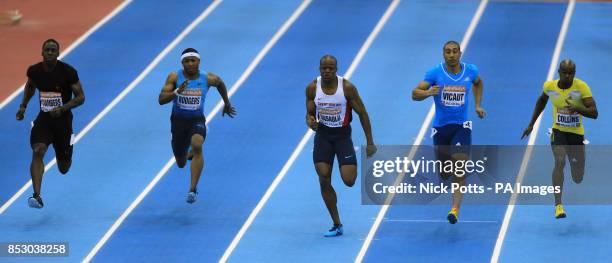 Great Britain's James Dasaolu wins the 60 Metres final beating Great Britain's Dwain Chambers into 4th and Kim Collins of St Kitts Nives 3rd during...