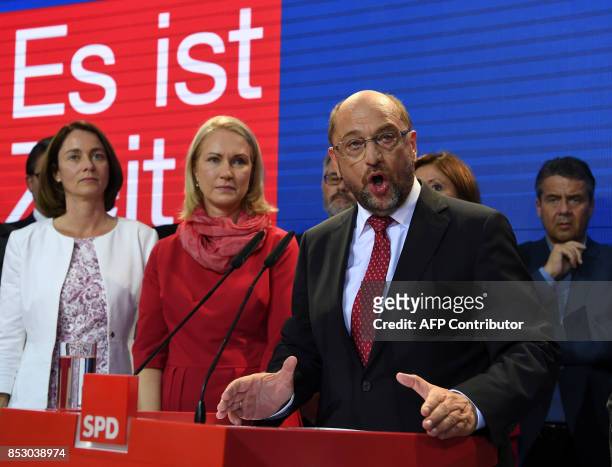 Chairman and candidate for Chancellor Martin Schulz reacts on stage with German Family Minister Katarina Barley , State Premier of...