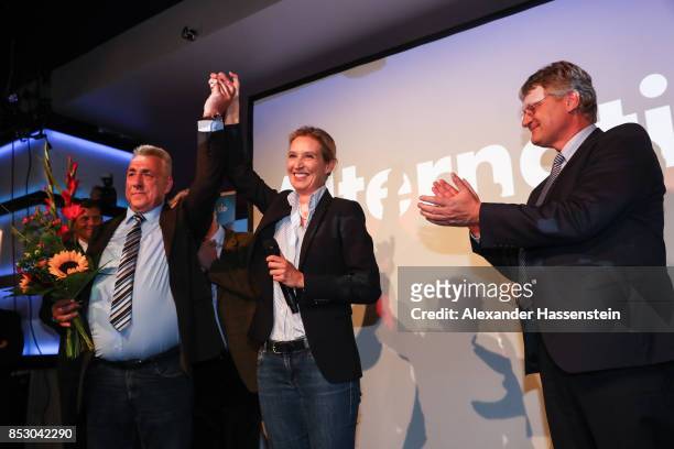 Alice Weidel , co-lead candidate of the Alternative for Germany , and Joerg Meuthen celebrate after the announcement of the initial results that give...