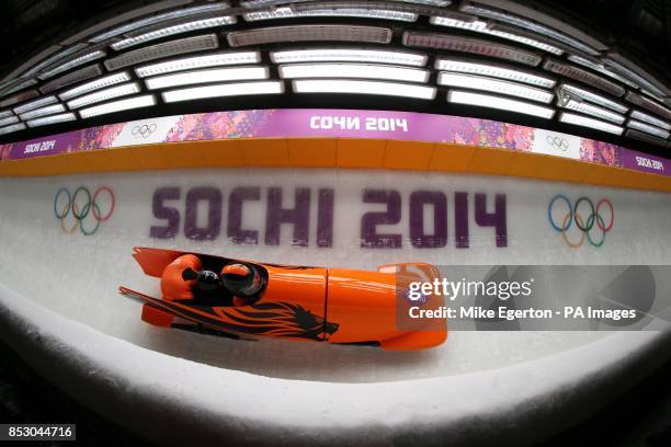 Netherland's driver Edwin van Calker and brakeman Bror van der Zijde in the Two-man Bobsleigh Heat Two at the Sanki Sliding Centre during the 2014...