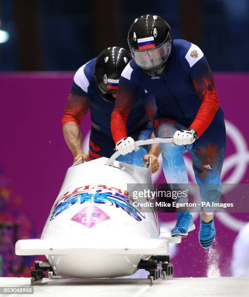 Russia's driver Alexander Zubkov and Alexey Voevoda start run 3 of the Men's Two Man Bobsleigh during the 2014 Sochi Olympic Games in Krasnaya...