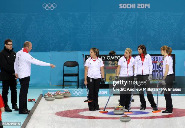 Great Britain's coach David Hay speaks with Vicki Adams, Anna Sloan, Eve Muirhead and Claire Hamilton during a time out in the Women's Curling Round...