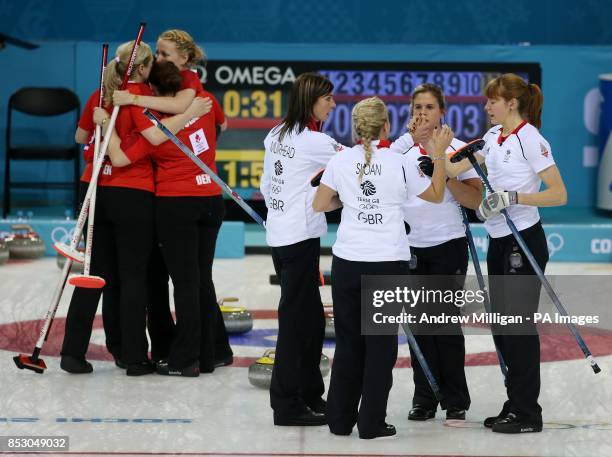 Great Britain's Eve Muirhead, Anna Sloan, Vicki Adams and Claire Hamilton shake hands as Denmark players celebrate their win in the Women's Curling...