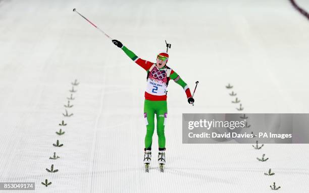 Belarus' Darya Domracheva celebrates victory in the Women's 12.5km Mass Start Biathlon during the 2014 Sochi Olympic Games in Sochi, Russia.