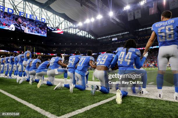 Members of the Detroit Lions take a knee during the playing of the national anthem prior to the start of the game against the Atlanta Falcons at Ford...