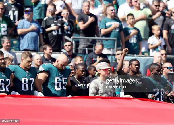 Members of the Philadelphia Eagles link arms during the national anthem before the game against the New York Giants on September 24, 2017 at Lincoln...