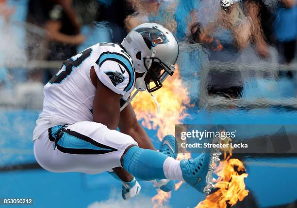 Jonathan Stewart of the Carolina Panthers runs onto the field before their game against the New Orleans Saints at Bank of America Stadium on...