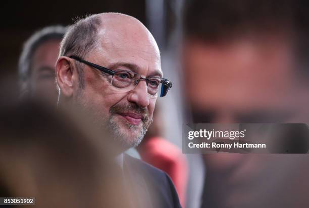 German Social Democrat and chancellor candidate Martin Schulz looks up after the announcement of the initial results that give the party 20,8% of the...
