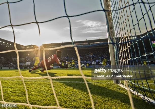 Strasbourg's French goalkeeper Bingourou Kamara catches the ball during the French Ligue 1 football match between Strasbourg and Nantes on September...