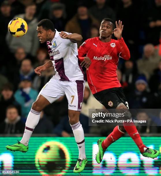 Aston Villa's Leandro Bacuna holds off a challenge from Cardiff City's Wilfried Zaha