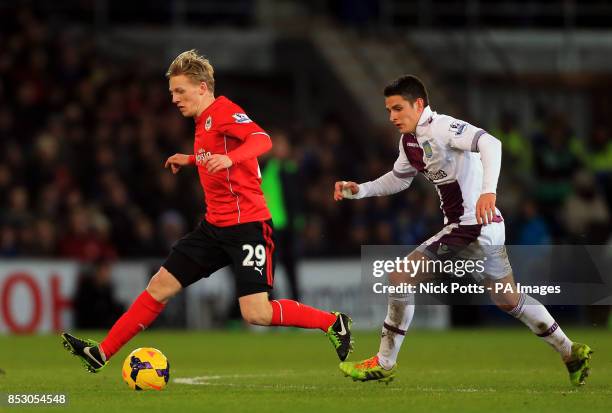 Cardiff City's Mats Moller Daehli holds off a challenge from Aston Villa's Ashley Westwood