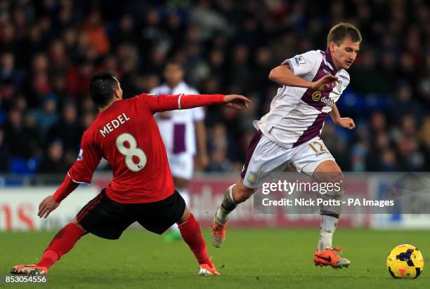 Aston Villa's Marc Albrighton beats Cardiff City's Gary Medel