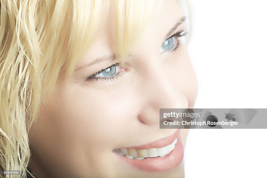 Young woman smiling, portrait, close up