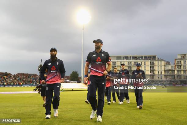 Liam Plunkett of England walks off the field as he finished with figures of 5 wickets for52 following England's 124 run victory during the third...