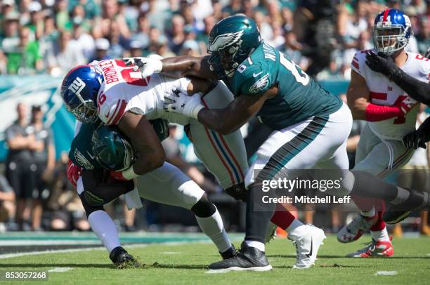 Jay Bromley of the New York Giants runs past Chance Warmack of the Philadelphia Eagles and sacks Carson Wentz in the first quarter at Lincoln...