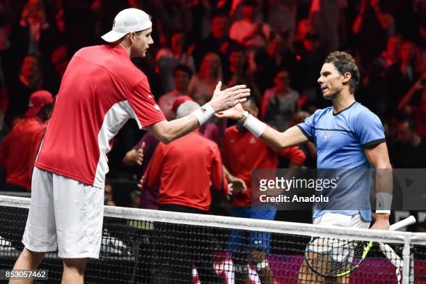 John Isner of the Team World and Spanish Rafael Nadal of the Team Europe salute each other during the Laver Cup in Prague, Czech Republic on...