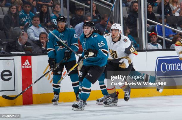 Kevin Labanc and Daniel O'Regan of the San Jose Sharks skate against Stefan Matteau of the Vegas Golden Knights at SAP Center on September 21, 2017...