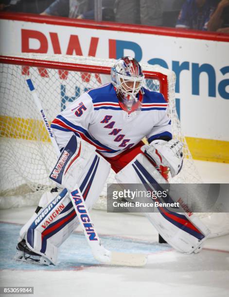 Brandon Halverson of the New York Rangers tends net during warmups prior to the game against the New Jersey Devils at the Prudential Center on...