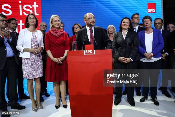 German Social Democrat and chancellor candidate Martin Schulz talks at the stage after election results that give the party 21% of the vote, giving...