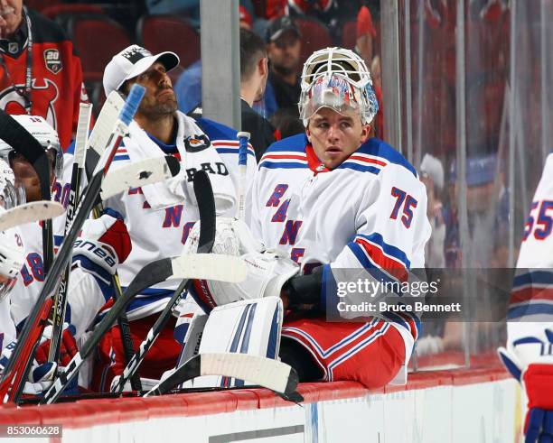 Brandon Halverson of the New York Rangers waits at the bench during the game against the New Jersey Devils at the Prudential Center on September 23,...