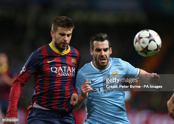 Barcelona's Gerard Pique and Manchester City's Alvaro Negredo