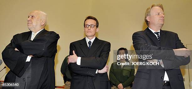 Helg Scarbi, dubbed the "Swiss Gigolo", and his lawyers Egon Geis and Till Gonterweiler wait at court for the start of his trial on March 9, 2009 in...