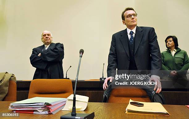 Helg Scarbi, dubbed the "Swiss Gigolo", and his lawyer Egon Geis wait at court for the start of his trial on March 9, 2009 in Munich, southern...