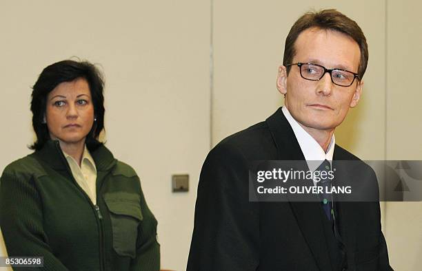 Helg Scarbi, dubbed the "Swiss Gigolo", waits at court for the start of his trial on March 9, 2009 in Munich, southern Germany, where he is accused...