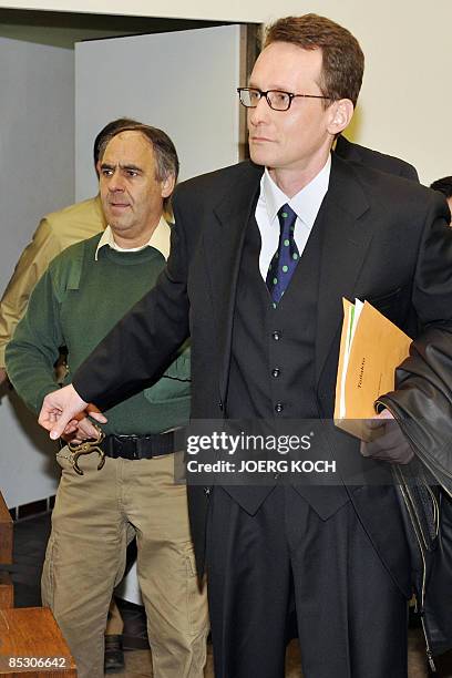 Helg Scarbi, dubbed the "Swiss Gigolo", arrives at court for the start of his trial on March 9, 2009 in Munich, southern Germany, where he is accused...