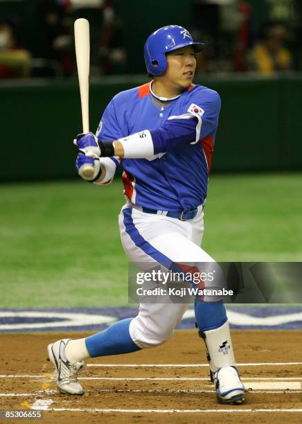 Outfielder Kim Hyun-Soo of South Korea swings in the top of first inning during the World Baseball Classic Pool A Tokyo Round match between Japan and...