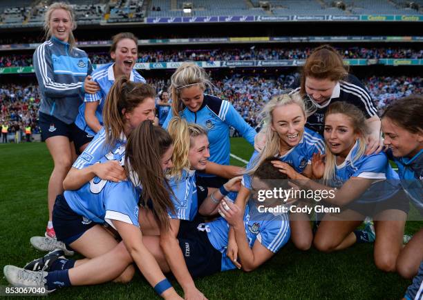 Dublin , Ireland - 24 September 2017; Noelle Healy of Dublin is mobbed by team-mates at the final whistle following the TG4 Ladies Football...