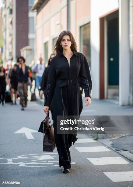 Model Georgia Fowler wearing a black overall is seen outside Trussardi during Milan Fashion Week Spring/Summer 2018 on September 24, 2017 in Milan,...