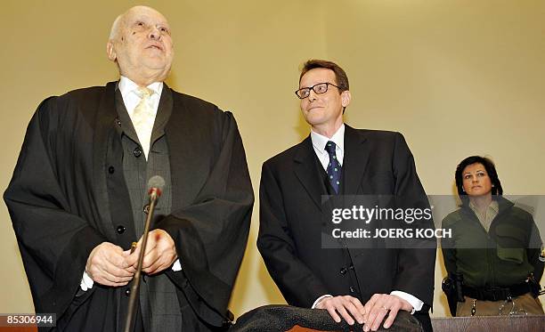 Helg Scarbi, dubbed the "Swiss Gigolo", and his lawyer Egon Geis wait at court for the start of his trial on March 9, 2009 in Munich, southern...