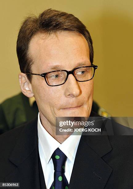 Helg Scarbi, dubbed the "Swiss Gigolo", waits at court for the start of his trial on March 9, 2009 in Munich, southern Germany, where he is accused...