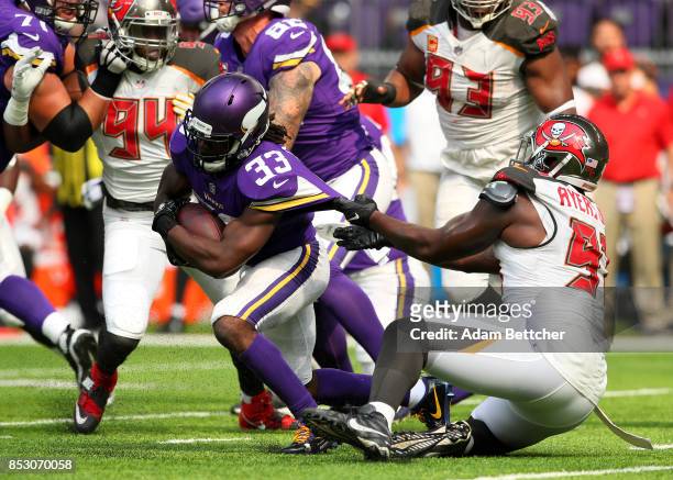 Dalvin Cook of the Minnesota Vikings runs with the ball in the first half of the game against the Tampa Bay Buccaneers on September 24, 2017 at U.S....