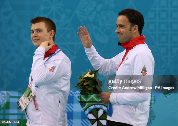 Great Britain's Greg Drummond and David Murdoch following the flower ceremony after taking Silver in the Men's Gold medal match at the Ice Cube...