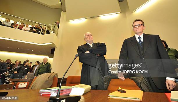 Helg Scarbi, dubbed the "Swiss Gigolo", and his lawyer Egon Geis wait at court for the start of his trial on March 9, 2009 in Munich, southern...