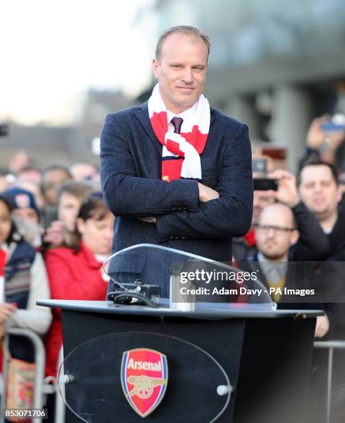 Former Arsenal player Dennis Bergkamp waits to unveil a statue of himself before the Barclays Premier League match at the Emirates Stadium, London.