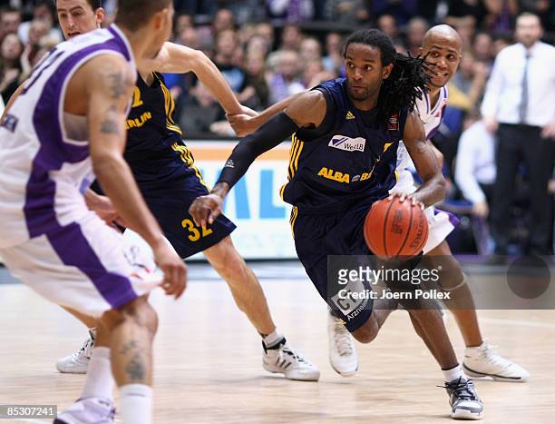 Julius Jenkins of Berlin dribbles during the Basketball Bundesliga match between MEG Goettingen and Alba Berlin at the Lokhalle on March 7, 2009 in...