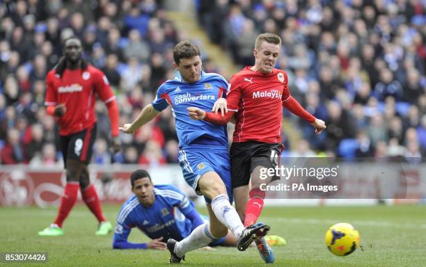 Cardiff City's Craig Noone and Hull City's Alex Bruce during the Barclays Premier League match at The Cardiff City Stadium, Cardiff.