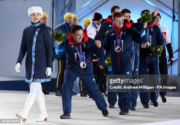 Great Britain's Skip David Murdoch leads his team during the medal ceremony at the Medals Plaza, after they won Silver yesterday during the 2014...