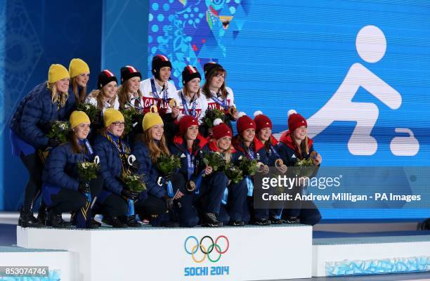 Silver medalists Sweden, Gold Medalists Canada and Bronze medalists Great Britain pose during the medal ceremony at the Medals Plaza during the 2014...