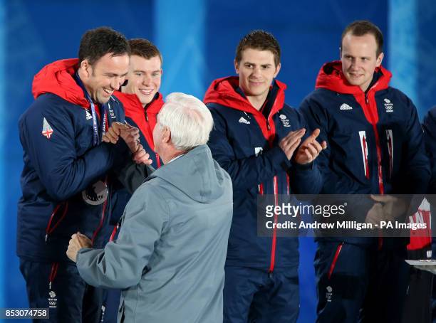 Great Britain's Men's curling team skip David Murdoch receives his silver medal during the medal ceremony at the Medals Plaza, during the 2014 Sochi...